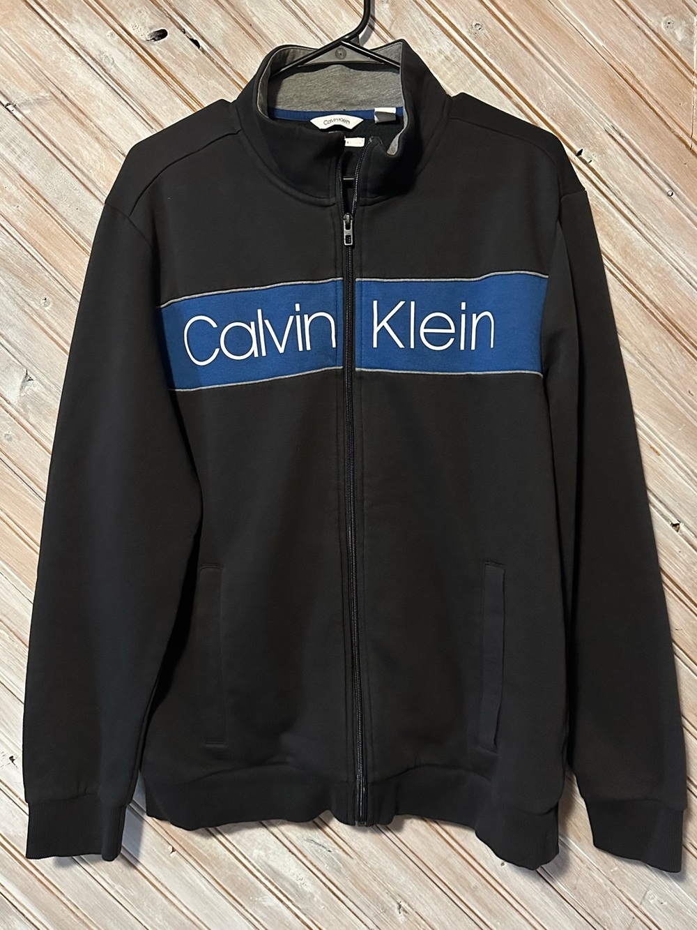 Calvin Klein Black Zip-Up Sweater Blue Logo Chest Panel Soft Touch Fleece
